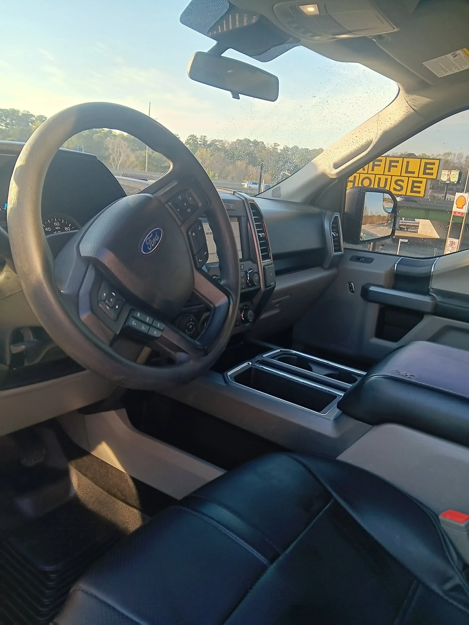Truck dashboard and interior surfaces cleaned and conditioned during a detail service