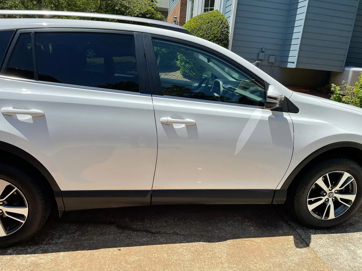 White SUV receiving a full exterior detail and wash service